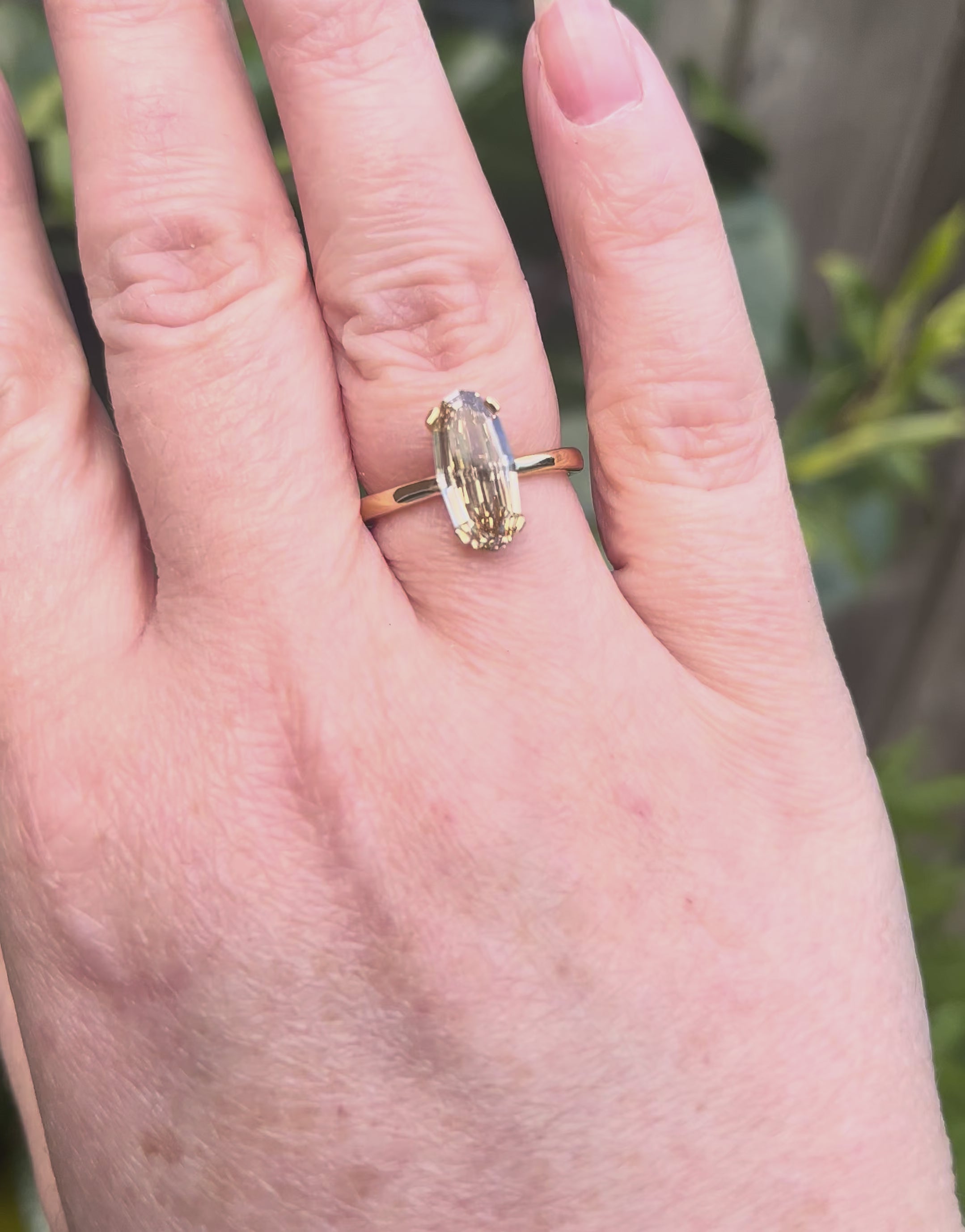 Brown Oval Step Cut Diamond on hand
