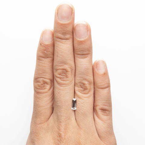 0.71ct White Sapphire Elongated Emerald Cut on hand