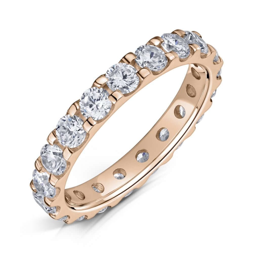 Rose Gold Eternity ring with 3.0mm diamonds all the way around on a white background.
