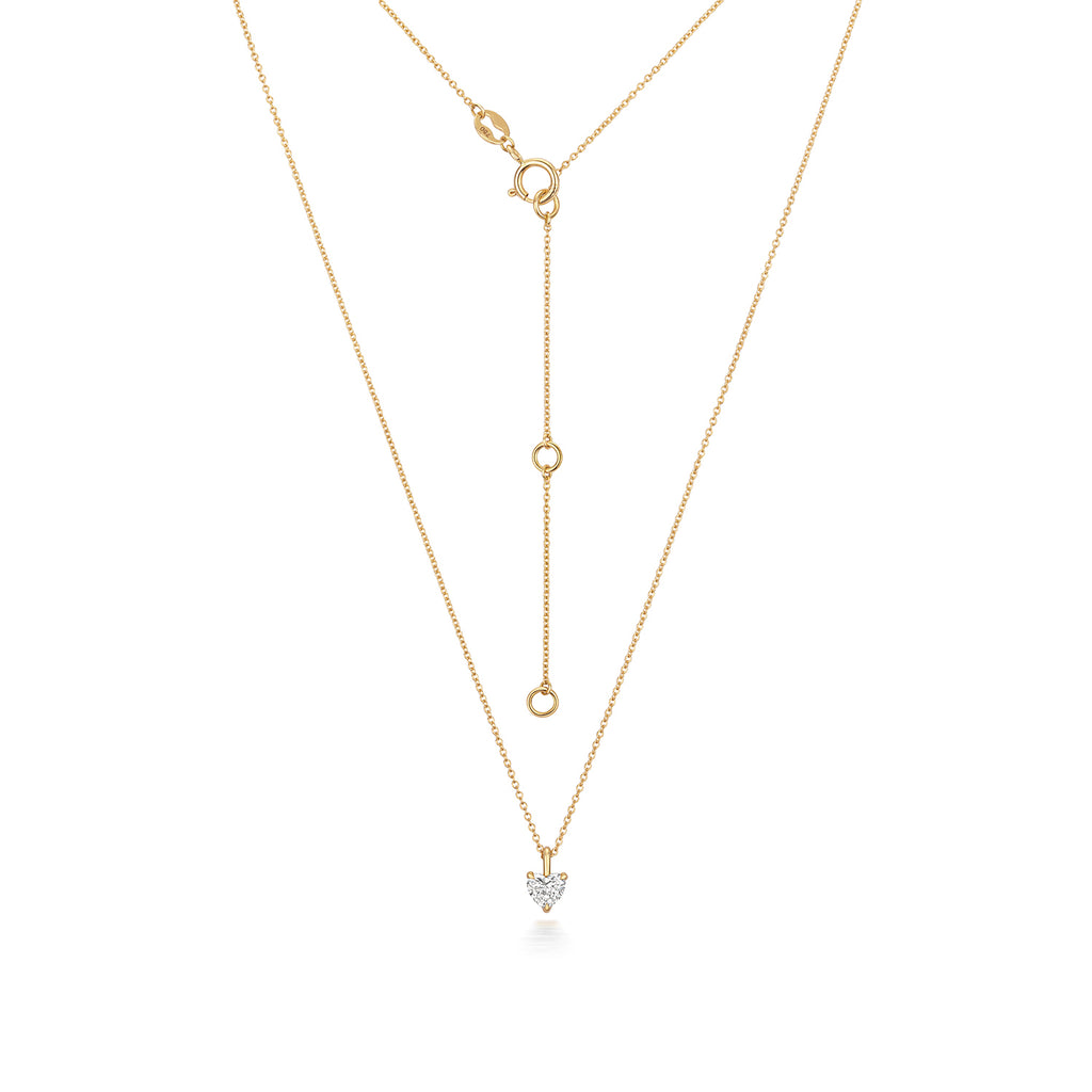 Heart Shaped Diamond Necklace in 18ct Yellow gold with adjustable chain on a white background.