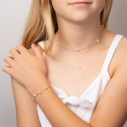 Children's Pearl Station Necklace and Bracelet being worn by little girl.