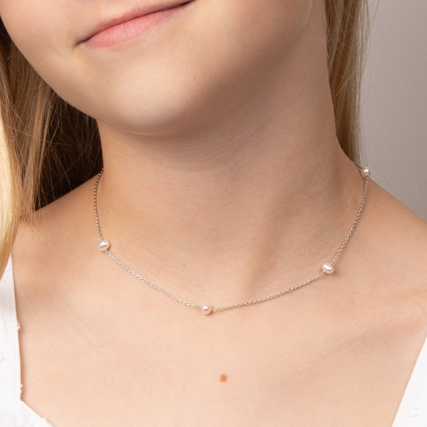 Children's Pearl Station Necklace on model.