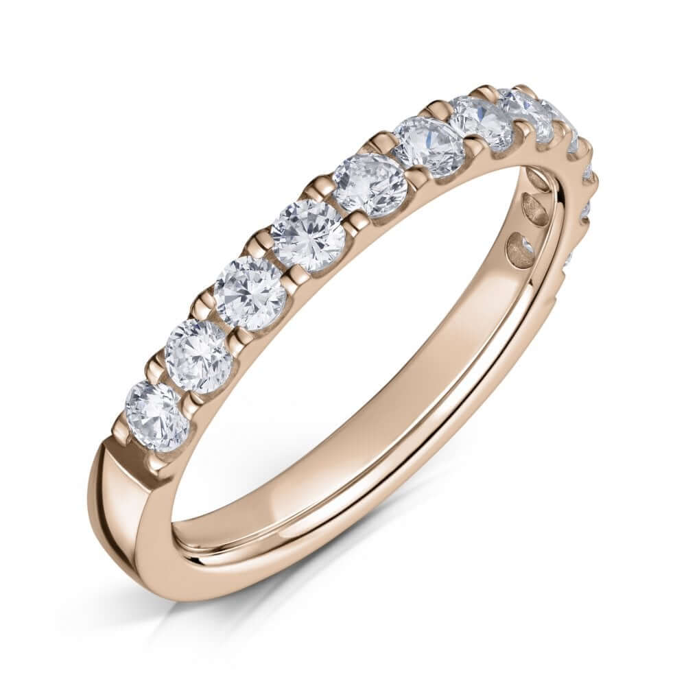 Rose Gold Eternity ring with 2.5mm diamonds half the way around on a white background.