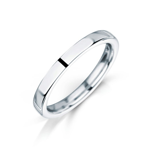 Angled view of ladies platinum engagement ring match wedding ring with white background.