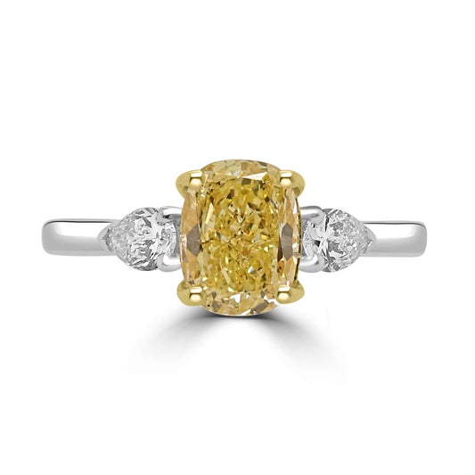 Fancy Yellow Diamond Engagement Ring on a white background. 