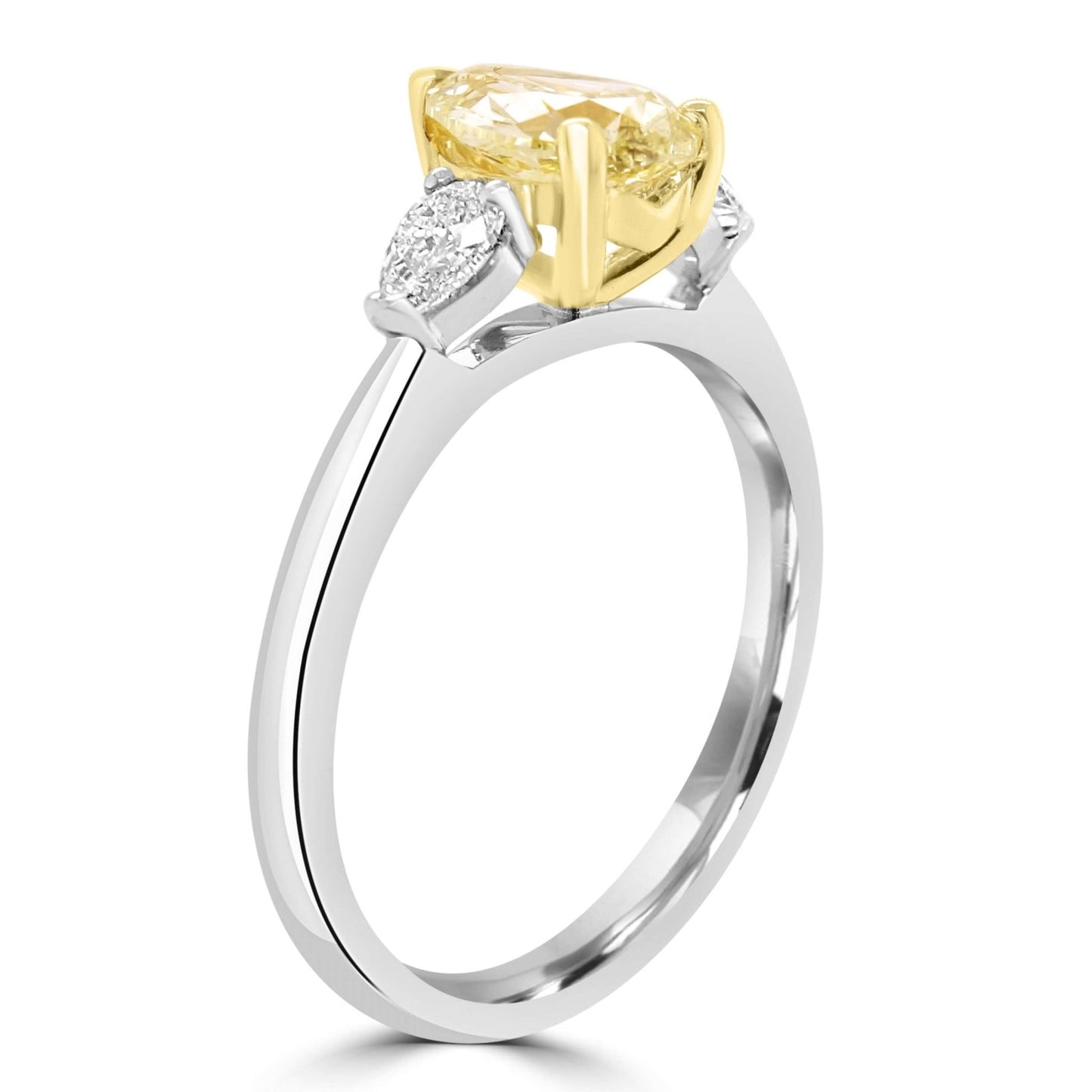 Side view of Fancy Yellow Pear Shaped Diamond Engagement Ring on a white background.