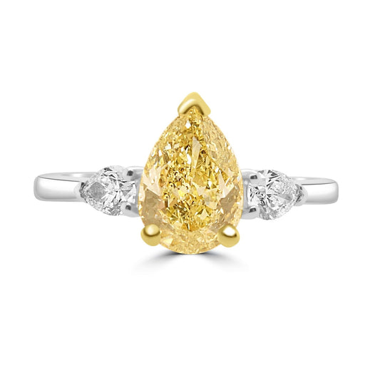 Fancy Yellow Pear Shaped Diamond Engagement Ring on a white background.